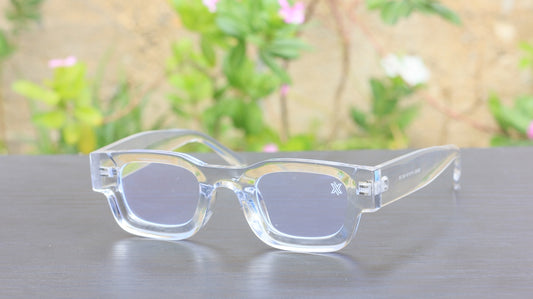 a pair of glasses sitting on top of a table