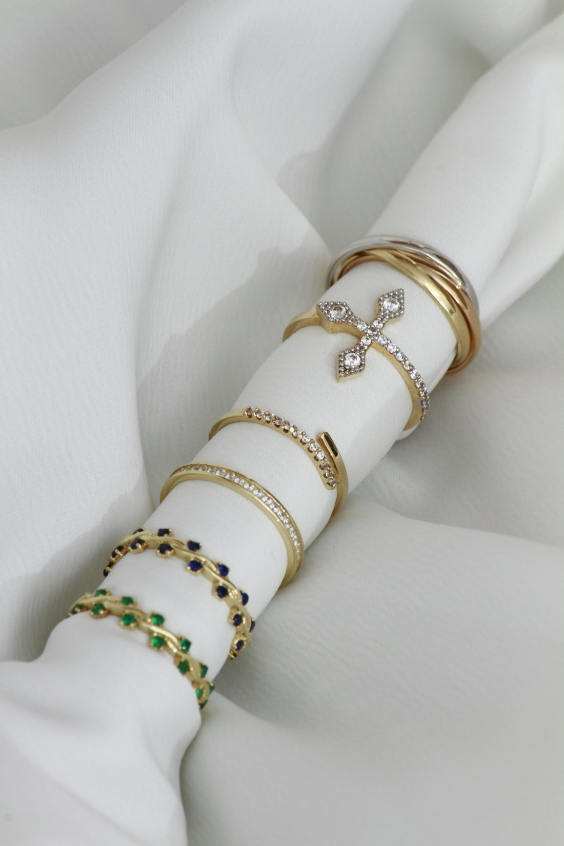 A close up of a napkin with rings on it