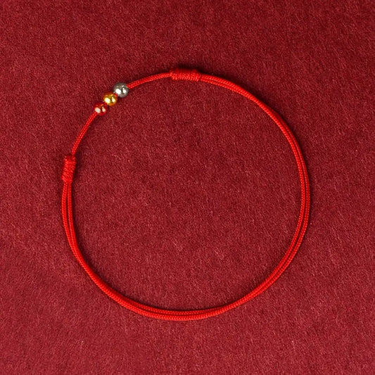 Pulsera Hilo Rojo Tres Oros 18K